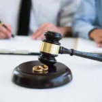 judge gavel and wedding rings during divorce proceedings