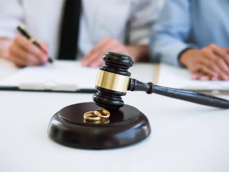 judge gavel and wedding rings during divorce proceedings
