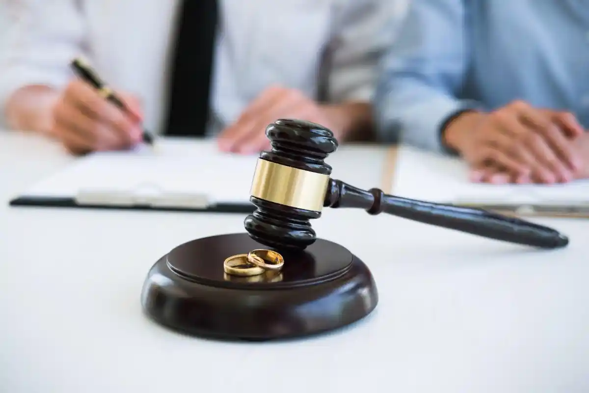 judge gavel and wedding rings during divorce proceedings